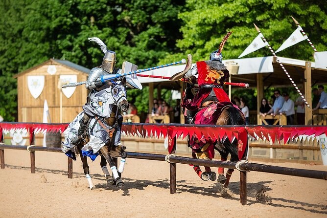 Two mounted knights in the tilt yard below Warwick Castle