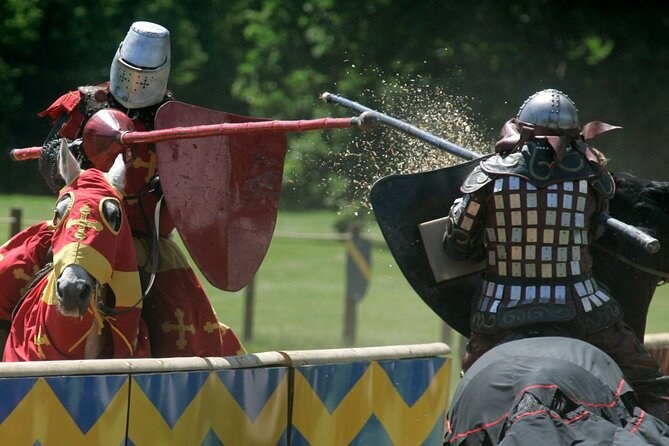 Two armoured knights fighting on foot in front of the castle lists