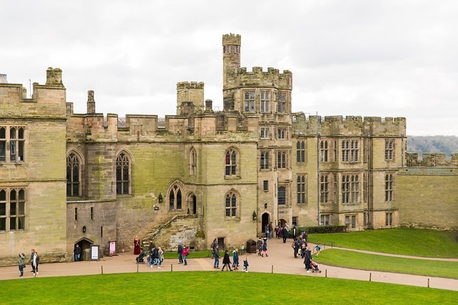 The east front of Warwick Castle across the open courtyard lawn