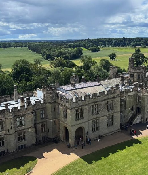Warwick Castle from above, with the Warwickshire countryside beyond